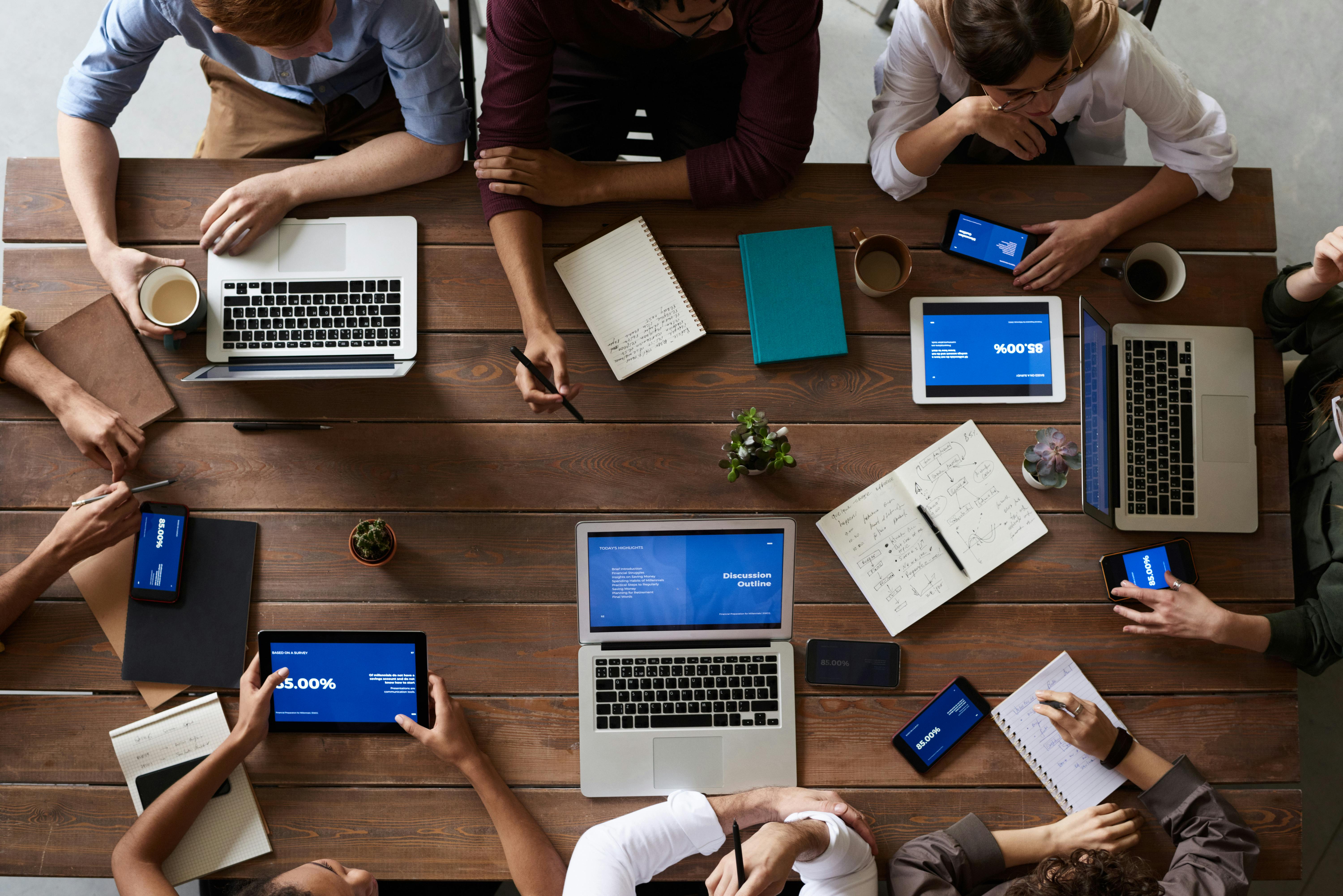 A group of people at a table working together